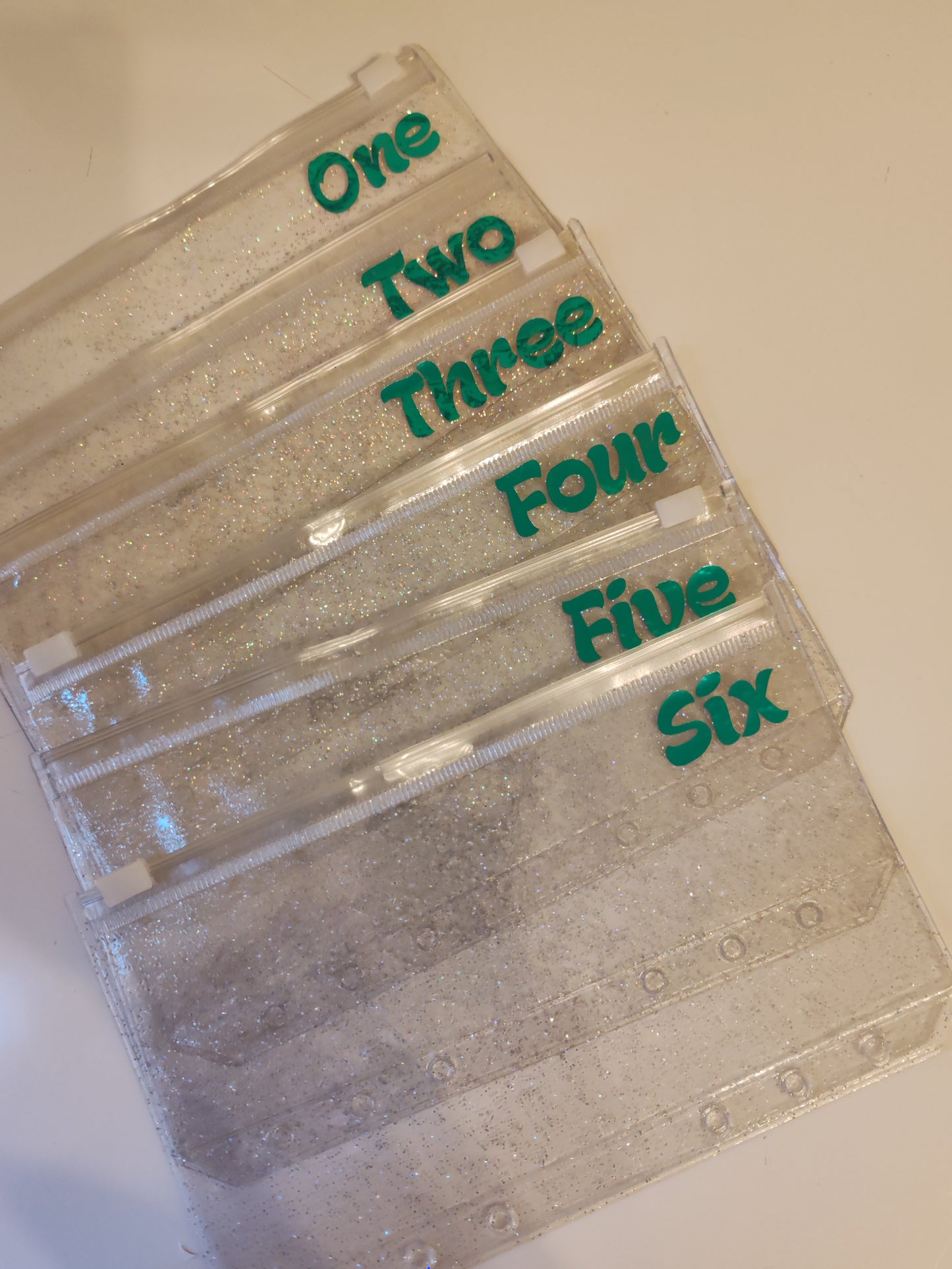 One - Six green vinyl A6 zip glitter envelope